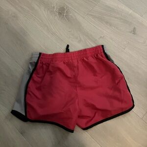 Hot pink athletic shorts.